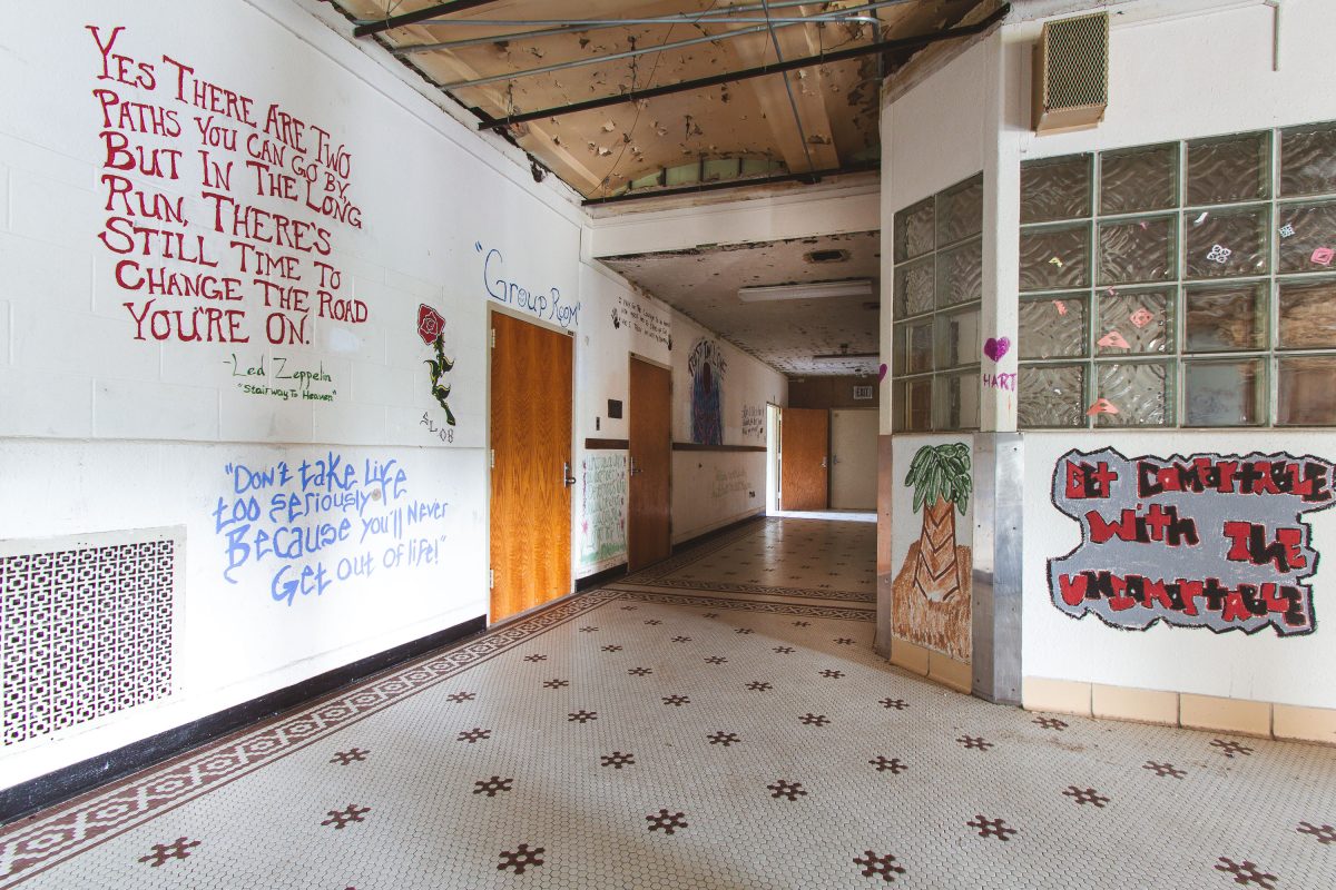 Hallway mural corridor with mosaic tile floor, Fergus Falls Kirkbride Building