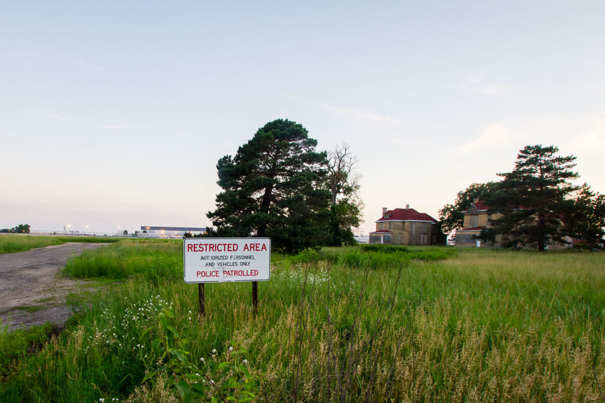 A "Restricted Area" sign in Fort Snelling nearing the Minneapolis-St. Paul International Airport.
