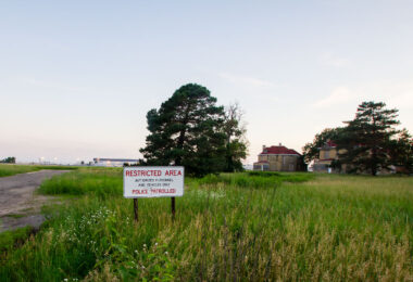A "Restricted Area" sign in Fort Snelling nearing the Minneapolis-St. Paul International Airport.