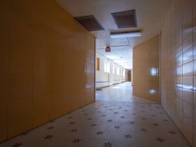 Tiled hallway with exit sign, Fergus Falls Kirkbride Building, Minnesota
