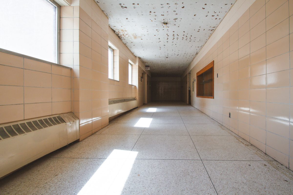 Tiled hallway with peeling ceiling, Fergus Falls Kirkbride Building, Minnesota