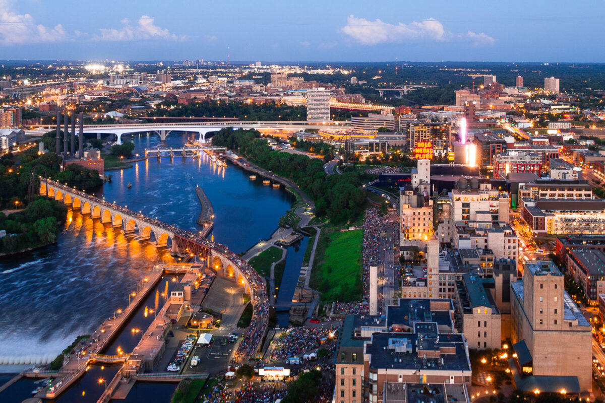 Crowds gather near the Mississippi River in Downtown Minneapolis during the annual Aquatennial fireworks.