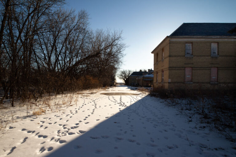 Fort Snelling Buildings in Winter Snow, Minneapolis 1 Historic buildings at Fort Snelling, Minnesota, covered in snow under a clear winter sky. The fort was established in the 1820s and played a key role in the region's military history.