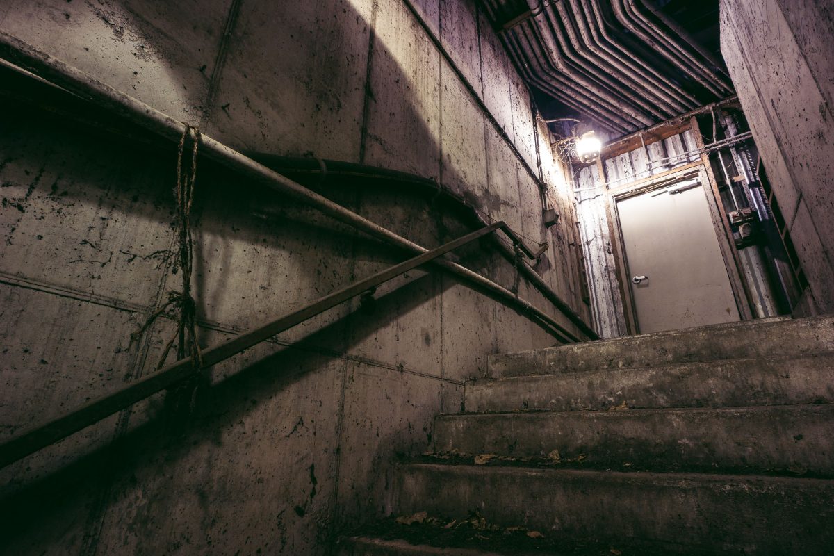Concrete stairwell with metal railing inside Upper Harbor Terminal, a former barge facility on the Mississippi River in north Minneapolis.