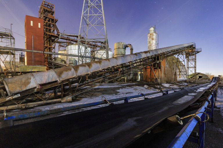 Conveyors at the Upper Harbor Terminal at Night 4 Abandoned barge terminal with rusted metal equipment and conveyor systems on the Mississippi River in north Minneapolis.