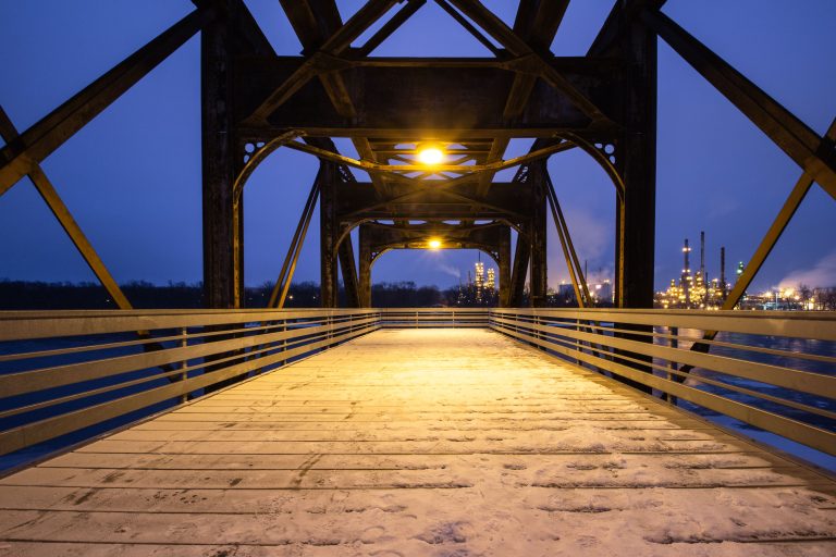 Rock Island Swing Bridge Walkway, Inver Grove Heights 2 Rock Island Swing Bridge in Inver Grove Heights with Marathon Petroleum refinery lit at dusk.