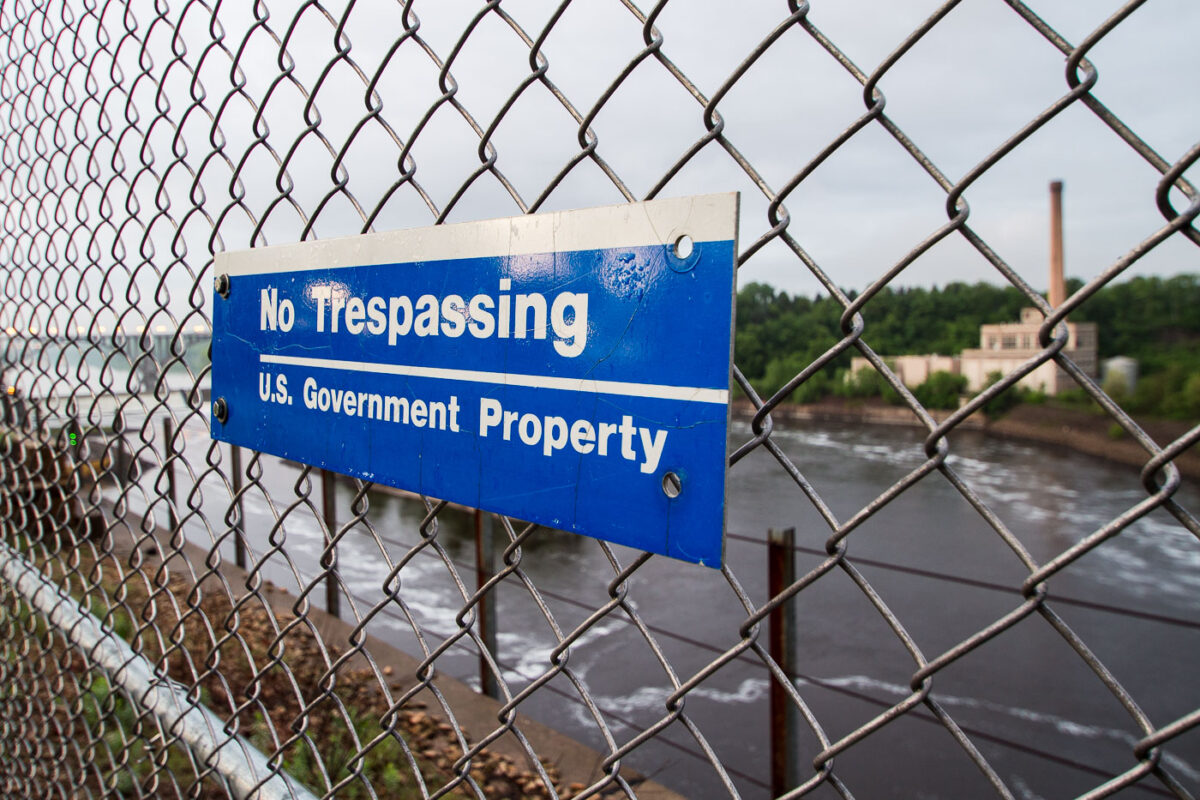 A sign reading "No Trespassing, US Government Property" in St. Paul, Minnesota.