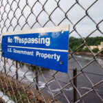 A sign reading "No Trespassing, US Government Property" in St. Paul, Minnesota.