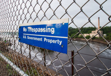 A sign reading "No Trespassing, US Government Property" in St. Paul, Minnesota.