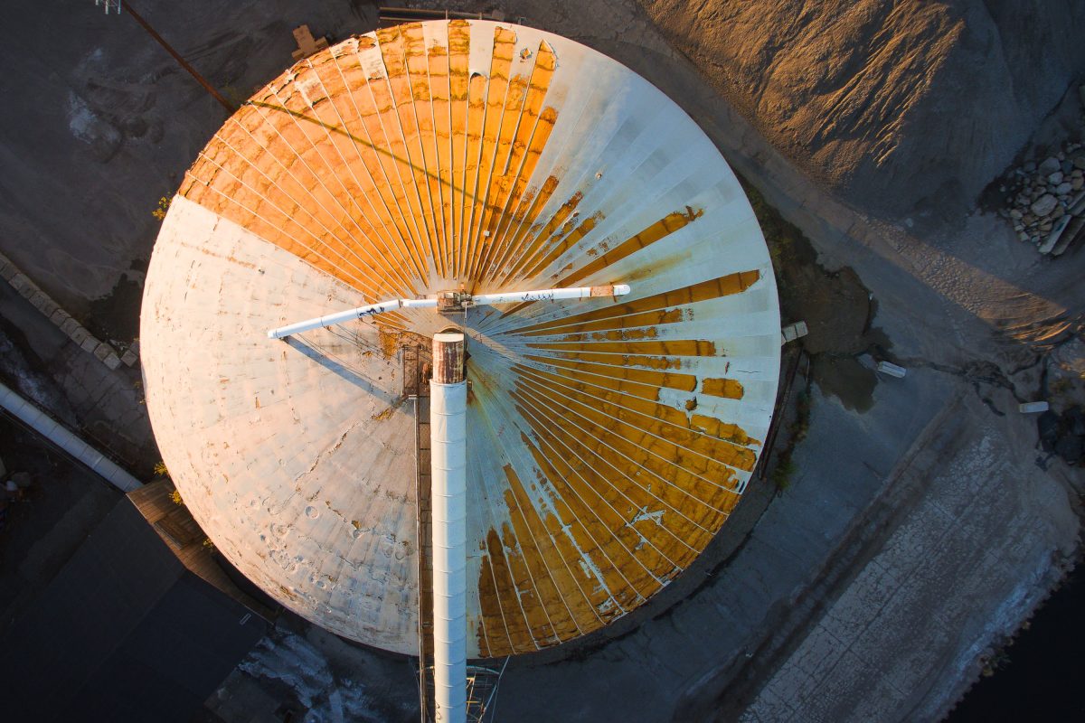 Aerial view of a circular barge loading dome at Upper Harbor Terminal on the Mississippi River in Minneapolis.