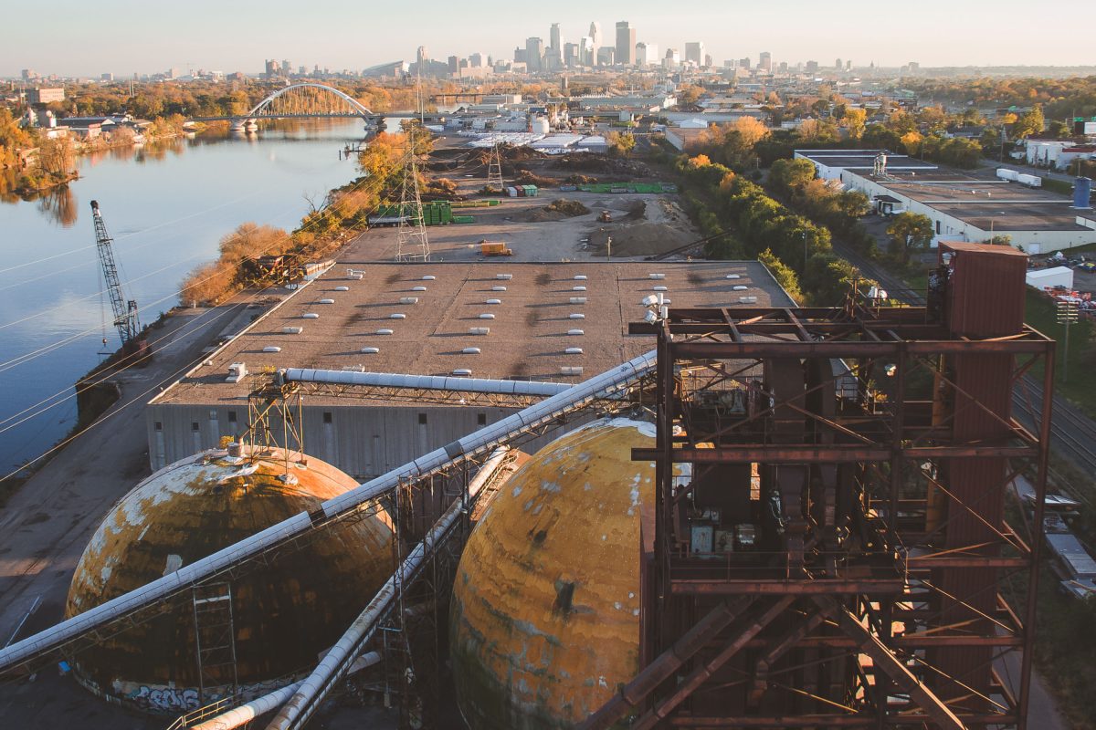 Upper Harbor Terminal, an abandoned barge facility on the Mississippi River in Minneapolis, with the downtown skyline visible beyond.