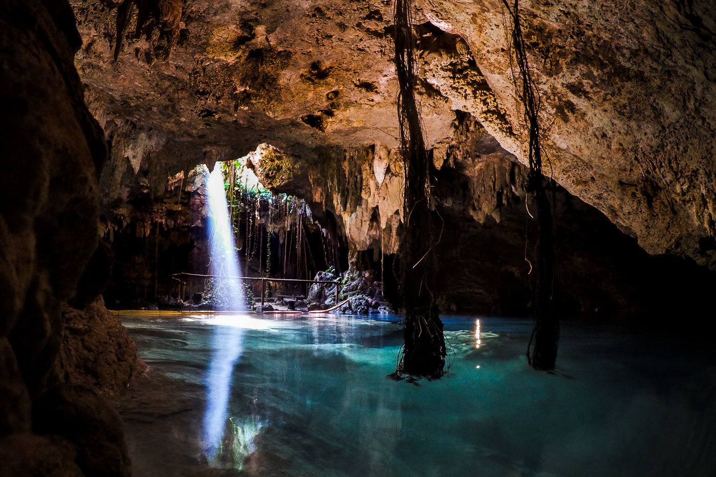 Light shining down into a cenote in Mexico