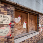 Signs hung on the historic building asking for it to be saved.
