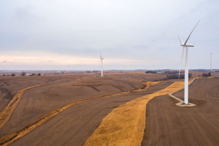 Wind Turbines in Adair, Iowa at Dusk 1 Wind turbines in a harvested agricultural field near Adair, Iowa, at dusk, generating clean energy.