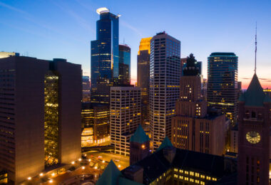 City Hall in the foreground with the Minneapolis Skyline behind it.