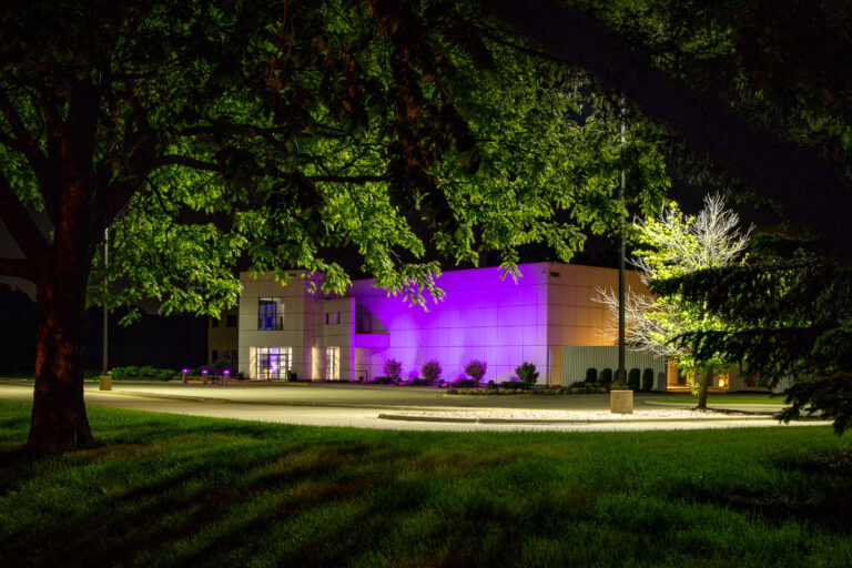 Paisley Park at Night, Chanhassen 2 Paisley Park in Chanhassen, Minnesota, illuminated at night with purple light.