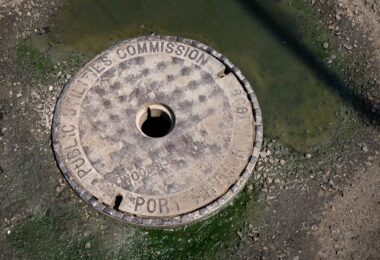 A 1906 manhole cover from the former Port Arthur Public Utilities Commission, now part of Thunder Bay’s unified public works system. Before amalgamating with Fort William in 1970, Port Arthur operated its own water, sewer, and electrical services, reflecting the industrial ambitions of this Lake Superior port. Cast in iron more than a century ago, the cover remains a tangible remnant of early municipal engineering in northwestern Ontario.
