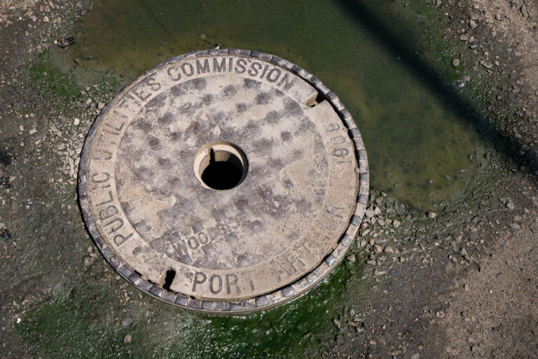 1906 Port Arthur Utilities Cover, Thunder Bay 4 A 1906 manhole cover from the former Port Arthur Public Utilities Commission, now part of Thunder Bay’s unified public works system. Before amalgamating with Fort William in 1970, Port Arthur operated its own water, sewer, and electrical services, reflecting the industrial ambitions of this Lake Superior port. Cast in iron more than a century ago, the cover remains a tangible remnant of early municipal engineering in northwestern Ontario.
