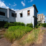 The remains of the Saskatchewan Pool B complex in Thunder Bay, Ontario, stand as a testament to the city’s industrial and maritime heritage. Once part of one of the largest grain handling networks on the Great Lakes, these structures were built in the early 20th century to serve the growing wheat trade flowing from the Canadian Prairies to Atlantic markets. Operations here slowed by the 1980s as newer, more efficient elevators replaced them. Today, the site lies silent along the waterfront, its silos and offices weathered by decades of Lake Superior winds.