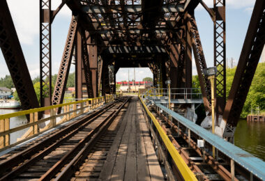 This steel swing bridge in Thunder Bay, Ontario, carries the Canadian Pacific Railway line across the Kaministiquia River near the city’s grain terminals. Built in the early 20th century, the structure allowed both rail and maritime traffic to pass through the busy industrial waterfront—pivoting open for ships bound to and from Lake Superior. The bridge remains an important relic of Thunder Bay’s era as one of Canada’s foremost grain-shipping hubs, linking prairie rail lines to Great Lakes freighters and global export routes.