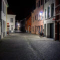 Bicycles on a brick road in Bruges, Belgium.