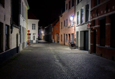Bicycles on a brick road in Bruges, Belgium.