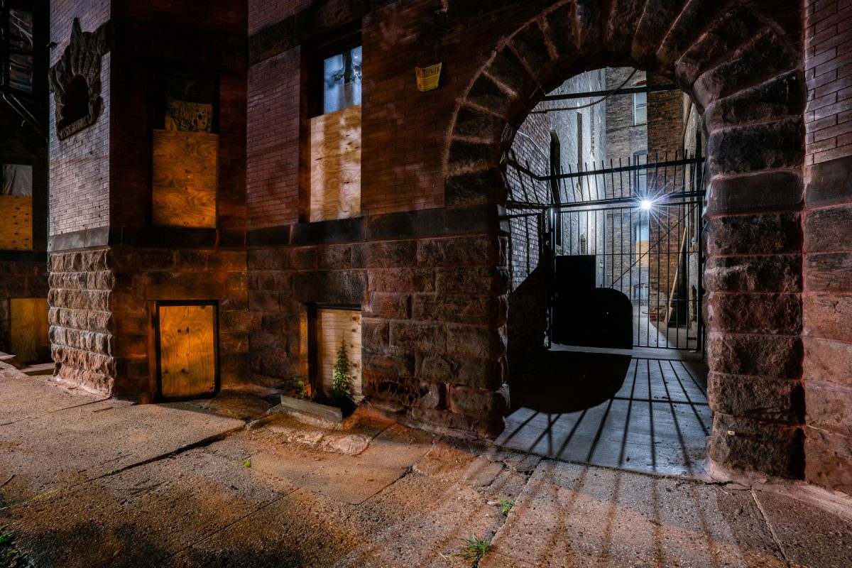 Boarded Windows and Gated Archway, Laurel Apartments, Minneapolis