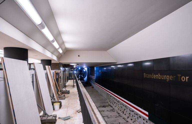 Brandenburger Tor U-Bahn Station Renovation, Berlin 4 Brandenburger Tor U-Bahn station platform under construction with equipment and illuminated tunnel, Berlin.