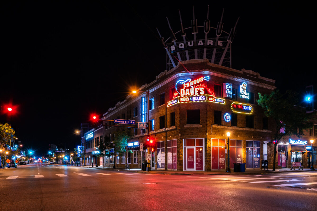 Calhoun Square at Hennepin Ave and Lake St in Minneapolis lit by neon at night