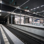 Berlin Hauptbahnhof’s lower-level platforms, located roughly 15 meters below street level, form part of Germany’s central north–south high-speed rail corridor. The underground section, opened in 2006 alongside the completion of the station’s glass-and-steel main hall, accommodates long-distance and regional trains running through the Tiergarten tunnel. The design emphasizes polished concrete, steel, and indirect lighting—elements typical of the Deutsche Bahn architectural style of the early 2000s. Platforms 1 through 8 serve ICE and IC services linking Berlin with cities such as Munich, Frankfurt, and Hamburg, while upper levels connect to the S-Bahn and U-Bahn networks.