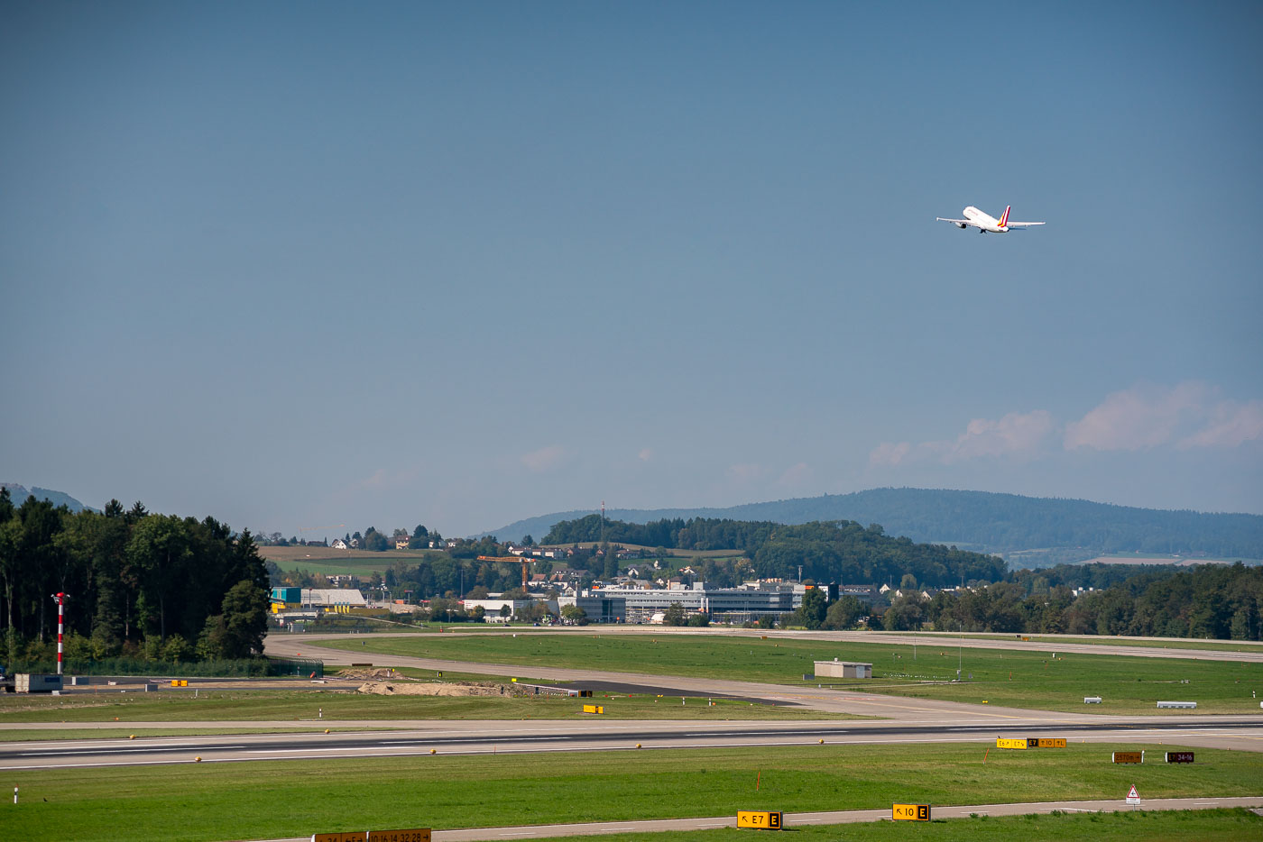 A plane taking off from Zurich airport.
