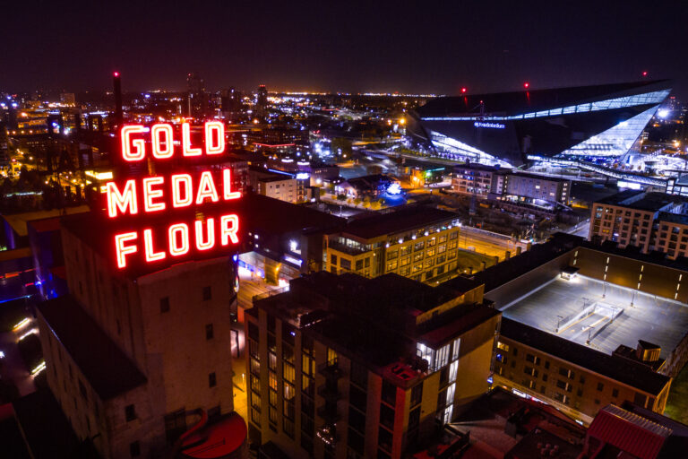 Gold Medal Flour and US Bank Stadium, Minneapolis 2 Lit up neon sign reading Gold Medal Flour, Minneapolis