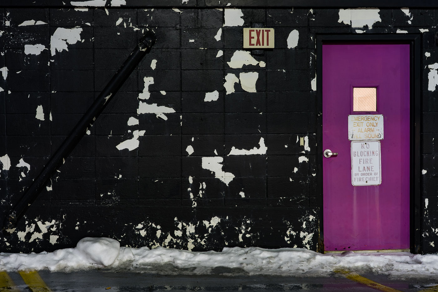 Peeling paint in a minneapolis parking garage on the door