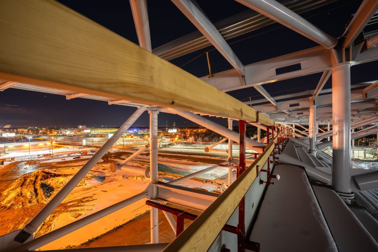 Roof Truss Framework at Night, Allianz Field Construction, St. Paul 4 Night photograph of Allianz Field stadium construction in St. Paul showing illuminated steel framework and structural supports.