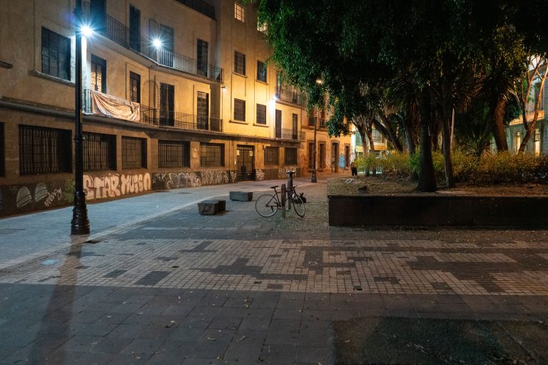 Calle de Regina at Night, Centro Histórico, Mexico City 3 Empty street at night on Calle de Regina in Mexico City's Centro Histórico, with a parked bicycle and graffiti-covered walls.