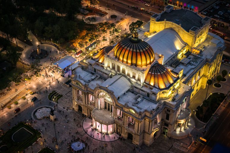 Domed Rooftop of Palacio de Bellas Artes at Night, Mexico City 4 Aerial night view of Palacio de Bellas Artes' domed roofline and surrounding plaza in downtown Mexico City.