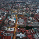 Evening Along Calle Madero, Centro Histórico 3 Calle Francisco I. Madero stretches eastward through Mexico City’s Centro Histórico, illuminated as evening falls. This pedestrian artery connects the Torre Latinoamericana to the Zócalo and has been a central commercial corridor since colonial times. Once known as San Francisco Street, its 2010 pedestrianization transformed it into one of the busiest walkways in Latin America, lined with historic facades, retail arcades, and landmarks like the Church of San Francisco and Casa de los Azulejos.