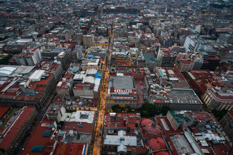 Evening Along Calle Madero, Centro Histórico 3 Calle Francisco I. Madero stretches eastward through Mexico City’s Centro Histórico, illuminated as evening falls. This pedestrian artery connects the Torre Latinoamericana to the Zócalo and has been a central commercial corridor since colonial times. Once known as San Francisco Street, its 2010 pedestrianization transformed it into one of the busiest walkways in Latin America, lined with historic facades, retail arcades, and landmarks like the Church of San Francisco and Casa de los Azulejos.