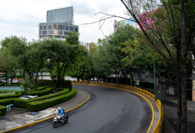 Someone driving a motorcycle around Fuente de los Buhos.