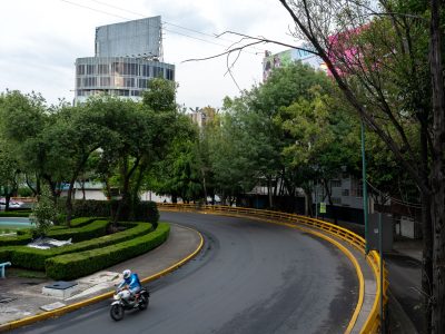 Motorcyclist by Fuente de los Buhos, Mexico City