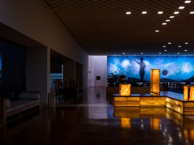 Illuminated Onyx Fixtures Beneath a Celestial Mural, Mexico City Hotel