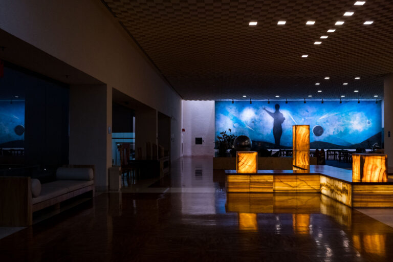 Mexico City Hotel Lobby with Celestial Mural 4 Mexico City hotel lobby with a celestial mural and illuminated onyx fixtures.