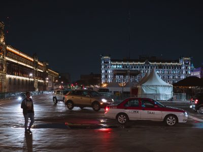Taxi and Traffic Near Palacio Nacional at Night