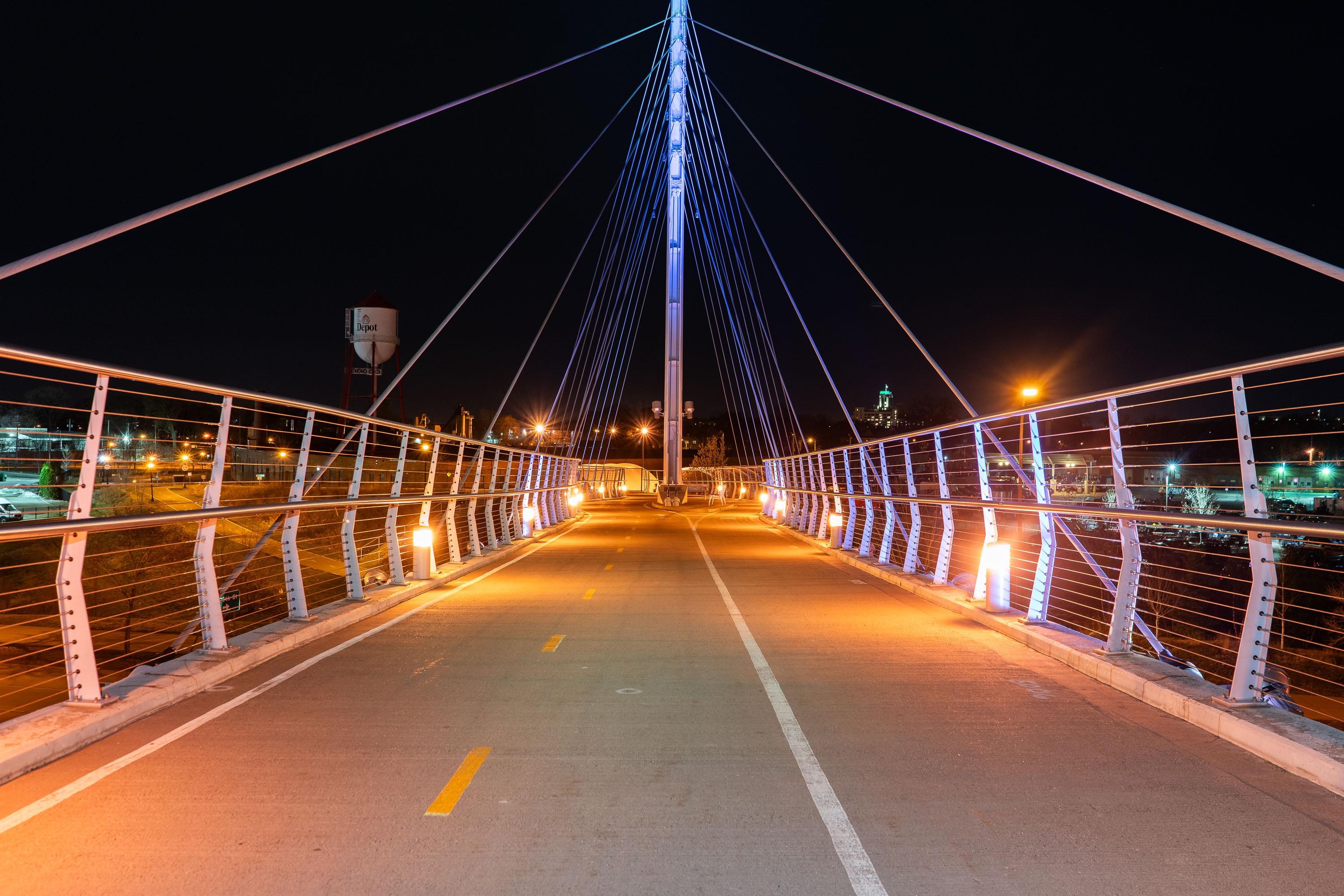 The Martin Olav Sabo Bridge, a pedestrian and bicycle bridge in Minneapolis, illuminated at night, connects the Longfellow and Seward neighborhoods over Hiawatha Avenue.
