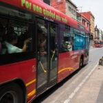 Metrobus Line 4 through Centro Histórico 1 A Mexico City Metrobus on Line 4 passes through the narrow streets of the Centro Histórico, heading toward the San Lázaro terminus. This route, introduced in 2012, was designed to connect the downtown core with the city’s main transit hubs and the airport while reducing congestion in one of Latin America’s most crowded historic districts. The red articulated buses operate along corridors like República de Uruguay and República de El Salvador, part of an effort to modernize and green urban mobility.
