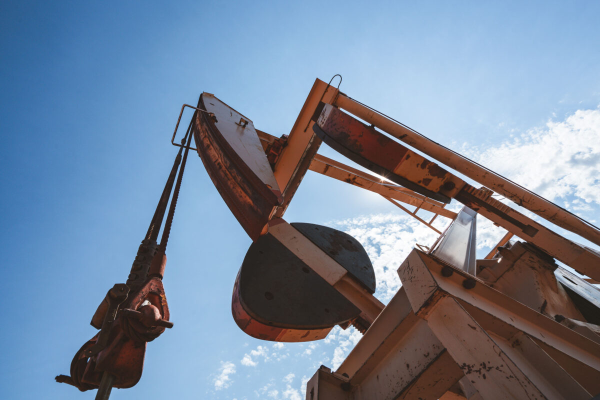 Pumpjack in North Dakota Oil Field Under Blue Sky