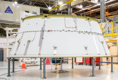The Orion Crew Module Adapter stands elevated on a support frame inside NASA’s Michoud Assembly Facility in New Orleans. This cone-shaped structure serves as the connection between the crew capsule and the European Service Module, housing critical systems for power, data, and environmental control during flight. Built as part of NASA’s Artemis program, the adapter ensures mechanical and electrical integration between Orion’s main components before launch on the Space Launch System rocket.