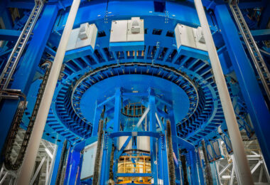 Inside NASA’s Michoud Assembly Facility in New Orleans, this massive blue structure is the Vertical Weld Center, used to fabricate the core stage of the Space Launch System (SLS) rocket. The machine employs friction-stir welding to join aluminum panels into large cylindrical sections that form the rocket’s fuel tanks. Operated by precision robotics, the weld center is one of the tallest of its kind in the world and plays a central role in preparing hardware for Artemis missions to the Moon and beyond.