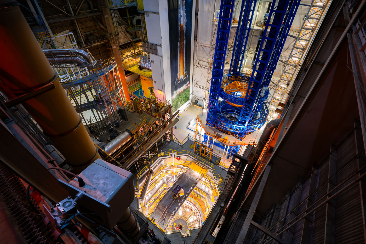 The large Space Launch System print on the wall was placed there to show what is being built in this room.
