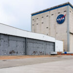NASA Michoud – Vehicle Assembly Building Exterior 1 The main assembly hall of NASA’s Michoud Assembly Facility in New Orleans, Louisiana, seen from the west apron. Originally constructed during World War II for manufacturing Liberty ships and later used for Saturn V and Space Shuttle external tank production, the site continues to play a central role in the U.S. space program. Today, Boeing and NASA engineers fabricate and assemble the massive core stages of the Space Launch System (SLS) inside this facility for Artemis missions to the Moon and beyond.